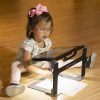 Young girl uses Matt Connect to draw while looking at the magnification on the tablet