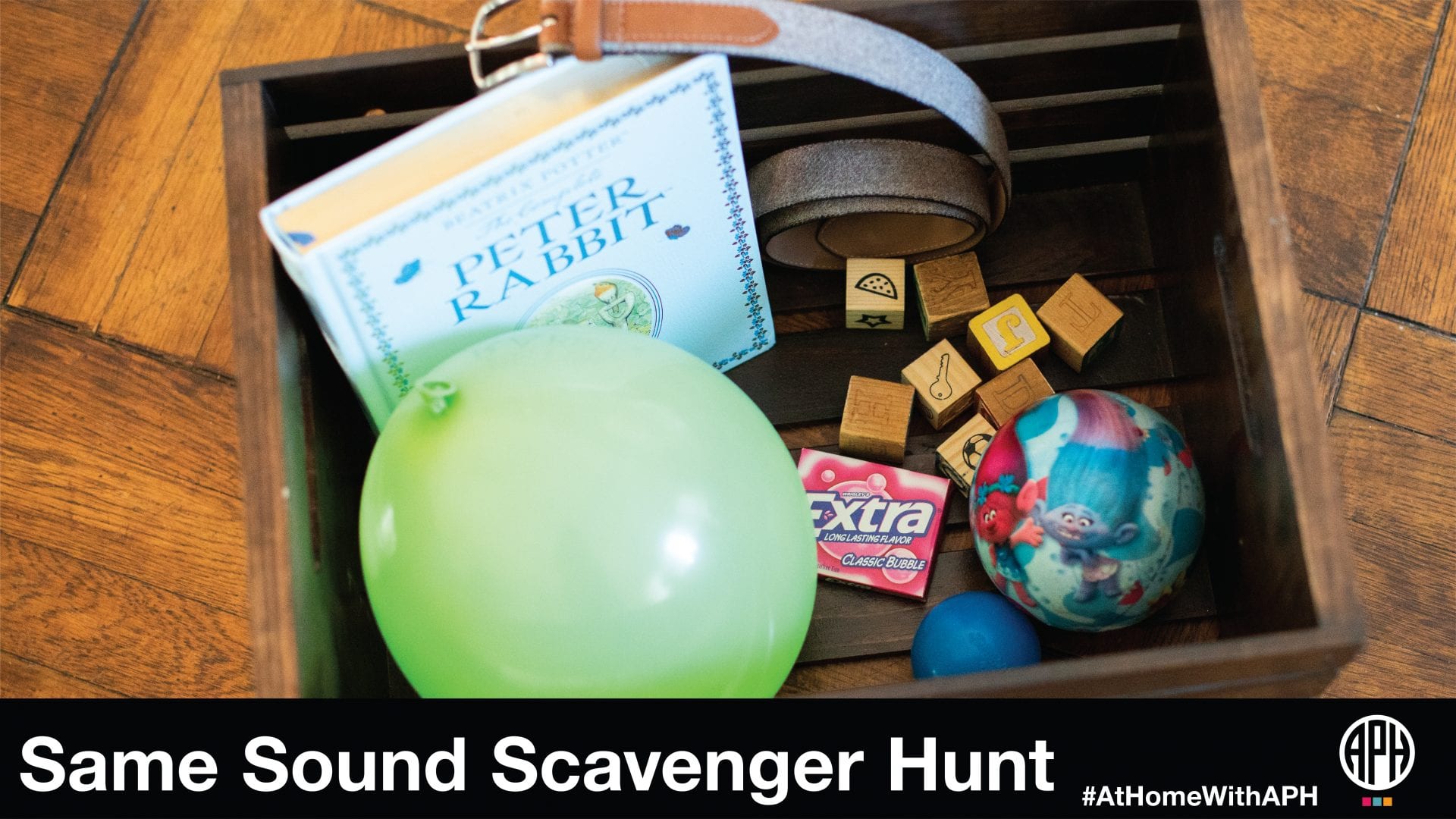 a box filled with "b" named items like ball and belt. text reads "Same Sound Scavenger Hunt #AtHomeWithAPH"