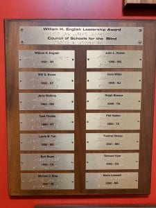 Plaque showing recipients of the William H. English Leadership Award from 1991-2002 in print and braille