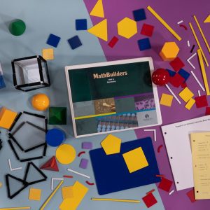 Bird's eye view of MathBuilders Unit 6 Kit: Geometry spread out to show the kits’ components including a felt board, textures shapes with hook/loop material backing, 3-D shapes, a guidebook, and more.