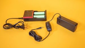 DC Supplement Adapter shown with battery recharger.