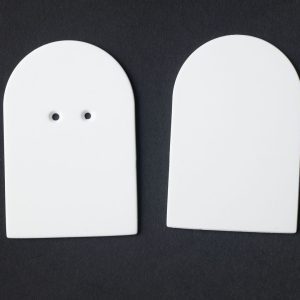 A package of white “bread”-shaped cards (10 undrilled and 5 two-hole drilled) on a black background.