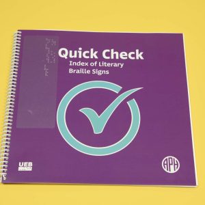 Quick Check Index of Literary Braille Signs UEB edition is a spiral-bound book featured over a yellow background. On the purple cover resides a large blue check mark in the middle, a UEB logo in the bottom left-hand corner, and the APH logo in the bottom right-hand corner.