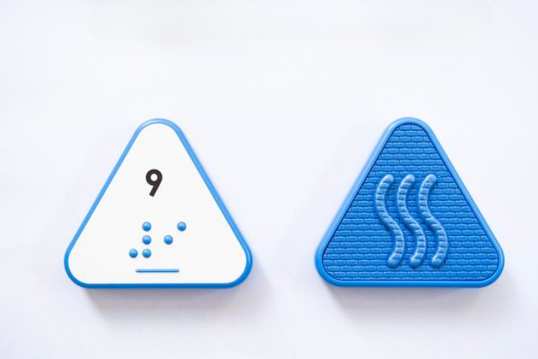 Close up comparison of the front and back of a blue triangular UEB Reach and Match number tile showing the number 9 in braille and print. The back of the piece is textured.