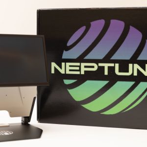 An opened Neptune device next to the black branded Neptune box. The device is white with a black base and a black monitor. The box has a purple and green graphic that reads, "NEPTUNE."