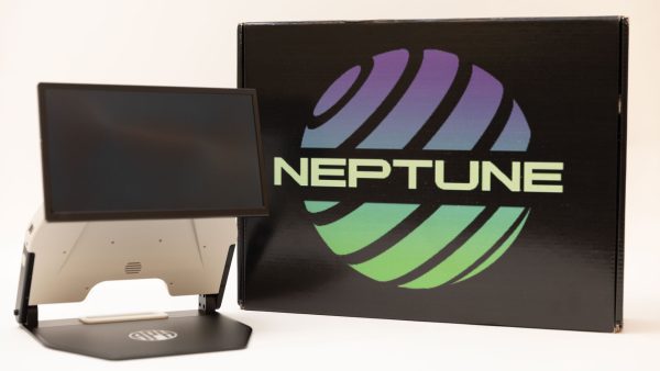 An opened Neptune device next to the black branded Neptune box. The device is white with a black base and a black monitor. The box has a purple and green graphic that reads, "NEPTUNE."