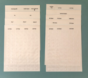 The additional symbols sticker sheets laid out on a teal background.
