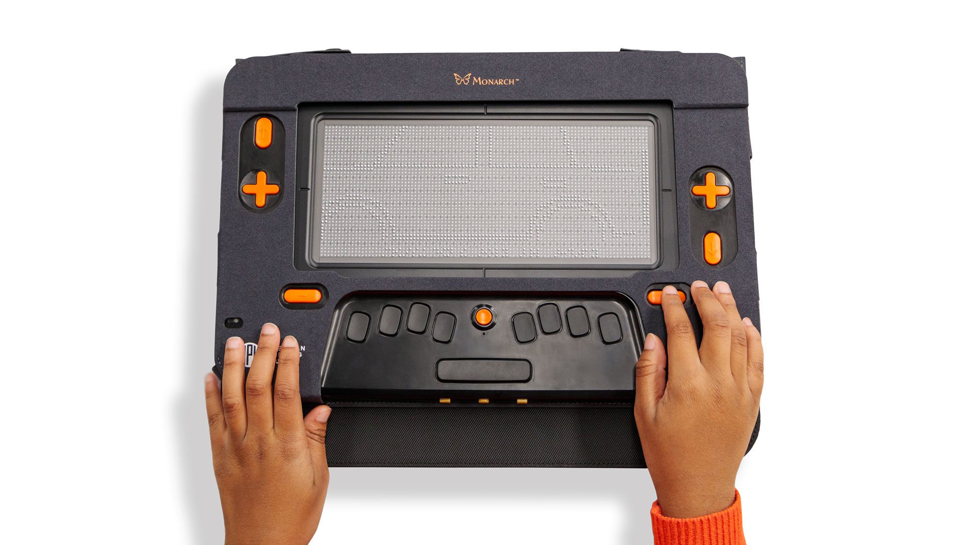 A Monarch displays a tactile image of a car. A students hands can be seen resting on the navigation keys.