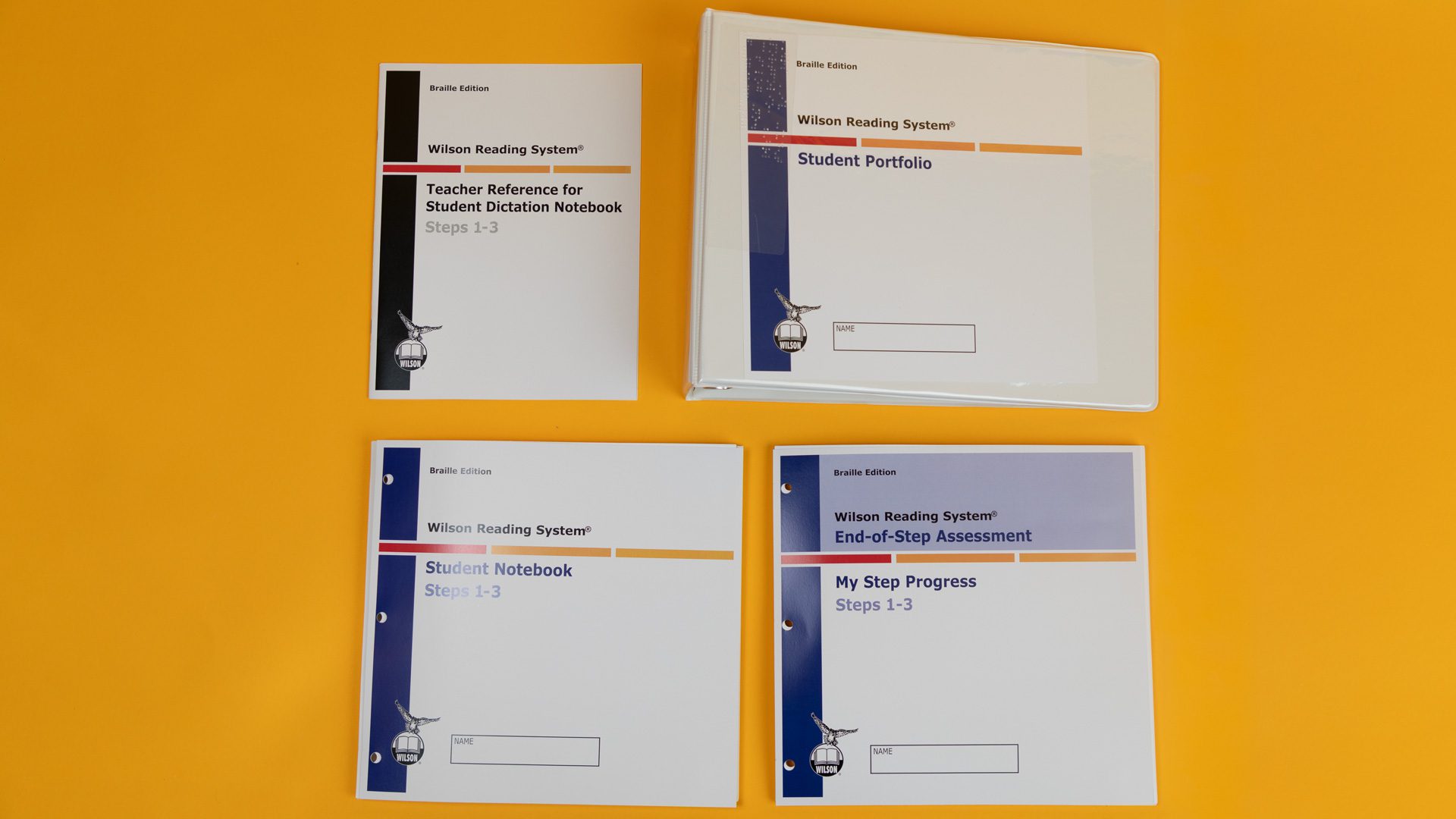 WRS-Braille-Materials_4Z9A1218-web The Wilson Reading System IV braille student portfolio, which includes a three-ring binder, the student notebook, "My Step" progress booklet, and a teacher reference for student dictation.