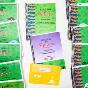 The components of the Building On Patterns Kindergarten, Second Edition Print Teacher's Kit on a white background. On either side are the green teacher's manuals laid out in lines, and in the middle are the teacher's booklet, the assessment booklet, and a stencil.