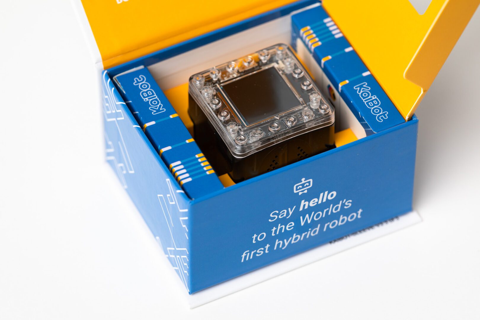 The yellow and blue KaiBot box opened to show the robot inside.